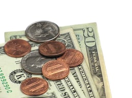 11967-close-up-of-some-dollars-and-coins-on-a-white-background-pv